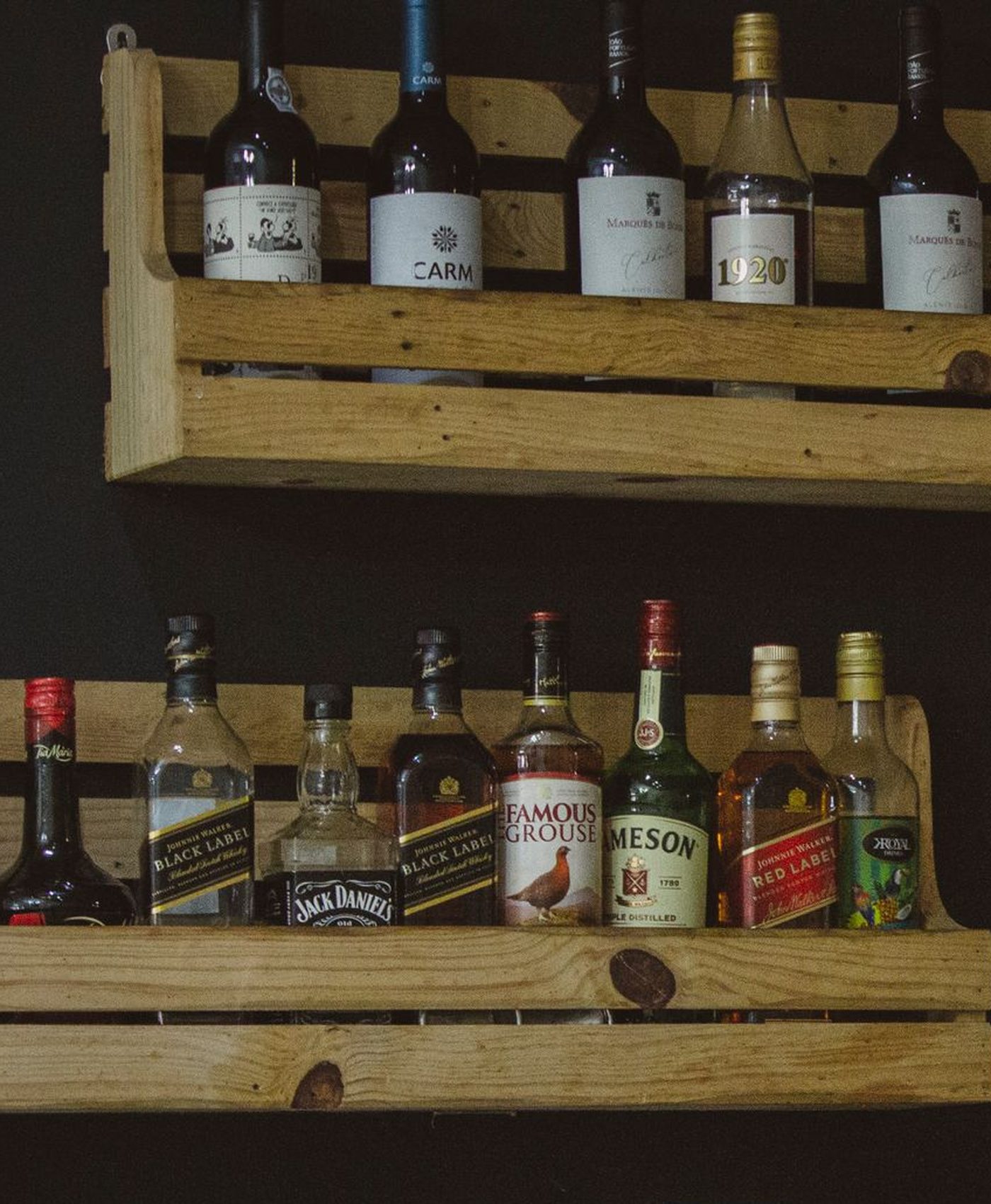 Shelves stocked with beer, wine and spirits at Lou’s Liquors